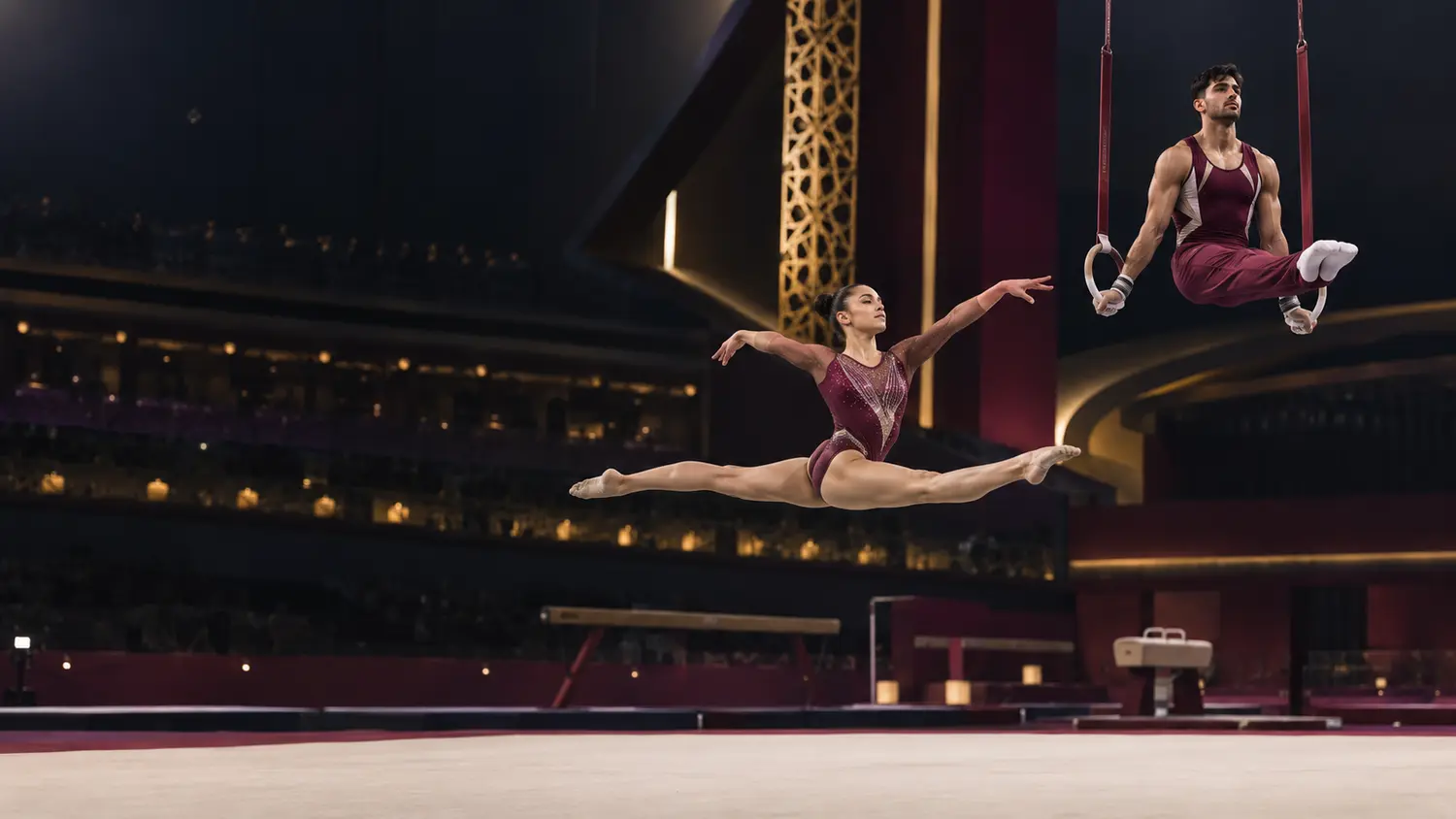 Artistic gymnasts training in a modern Qatar arena